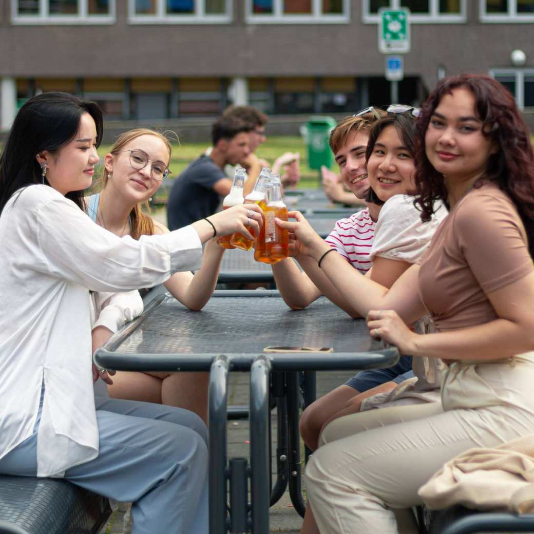 Students enjoying beers outside