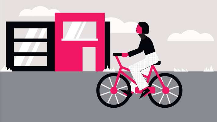 421e0660-dd20-11ee-a3a9-89ace6cfcaeb illustratie van vrouw die fietst langs gebouwen