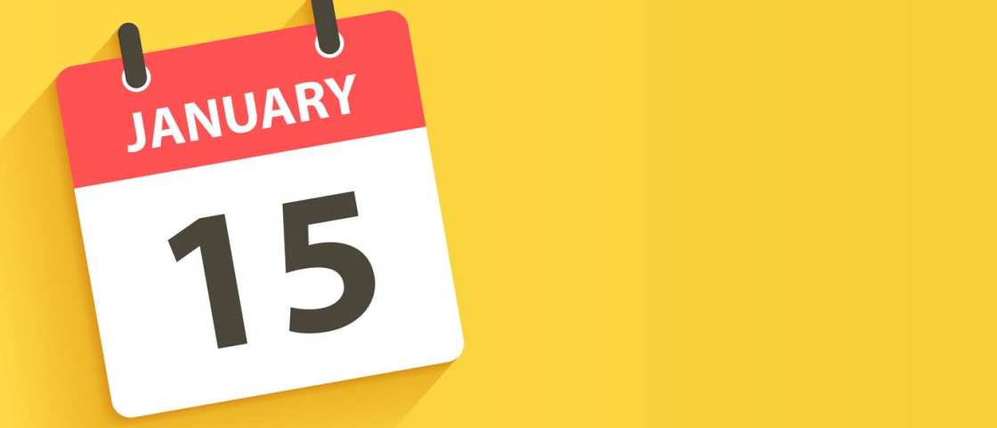 Een kalender die 15 januari als datum aangeeft tegen een gele achtergrond. 