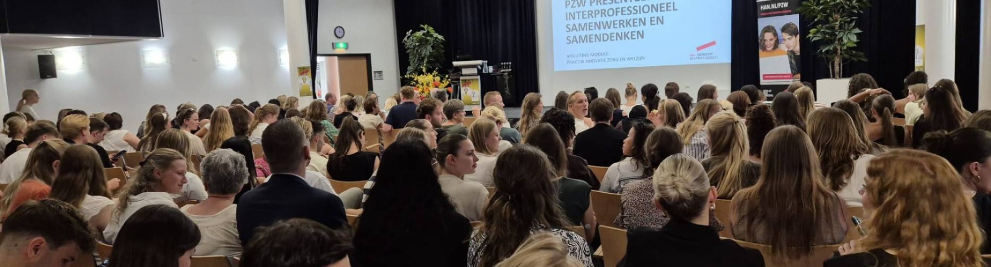 Deelnemers in de zaal bij het eindsymposium Praktijkinnovatie in Zorg en Welzijn