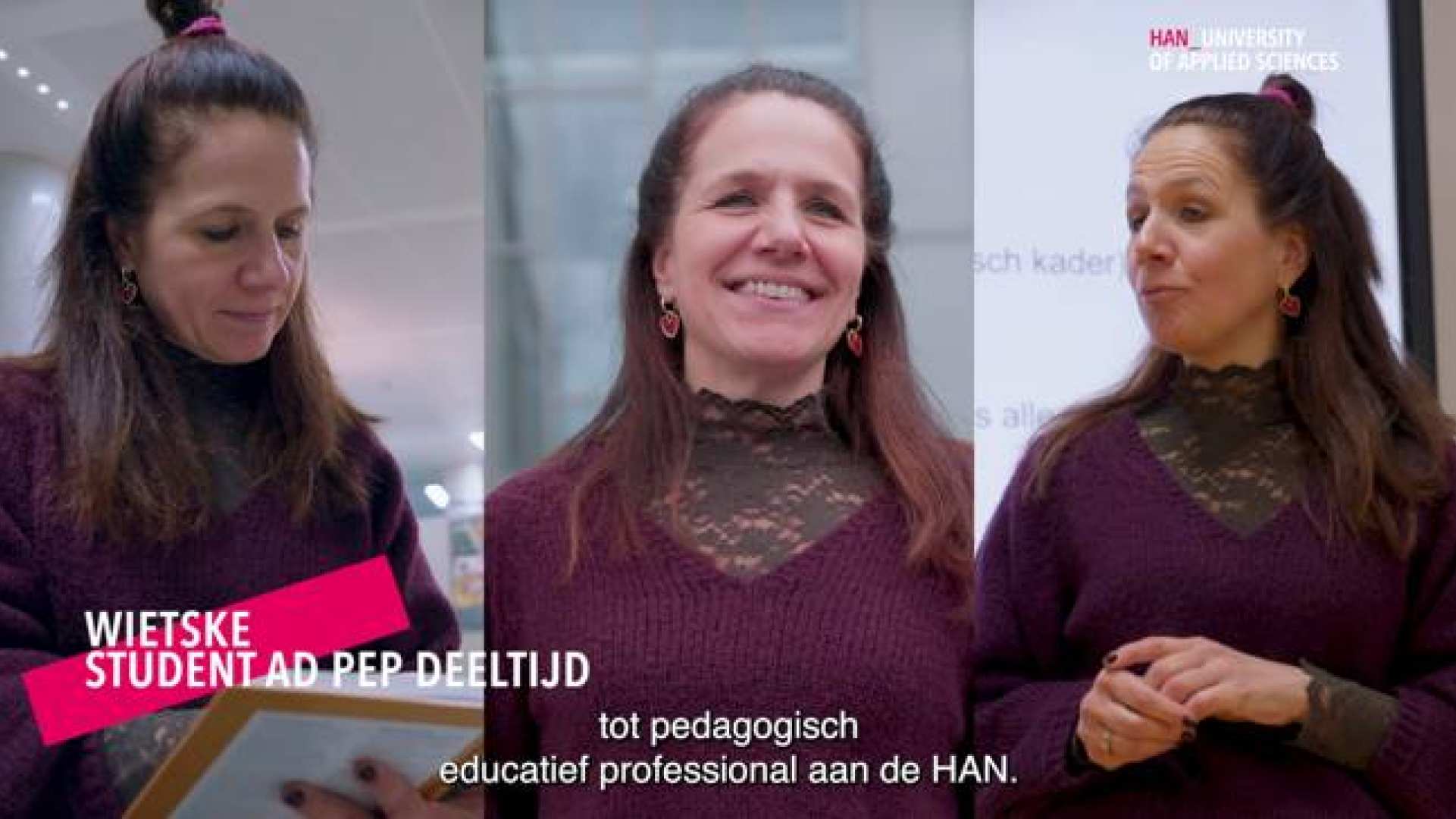 Een vrouw met een knotje die een blouse draagt.