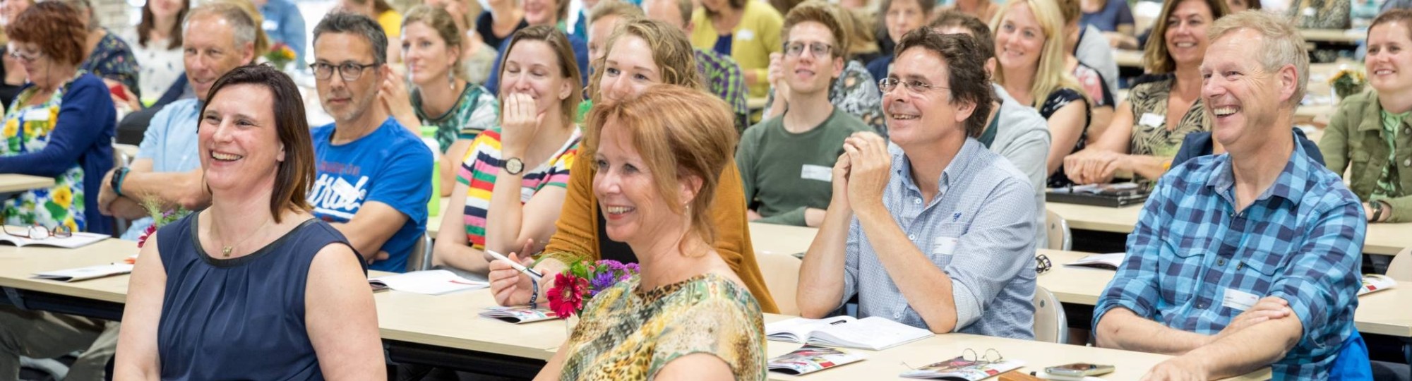 symposium zaal voorin programmamanagers