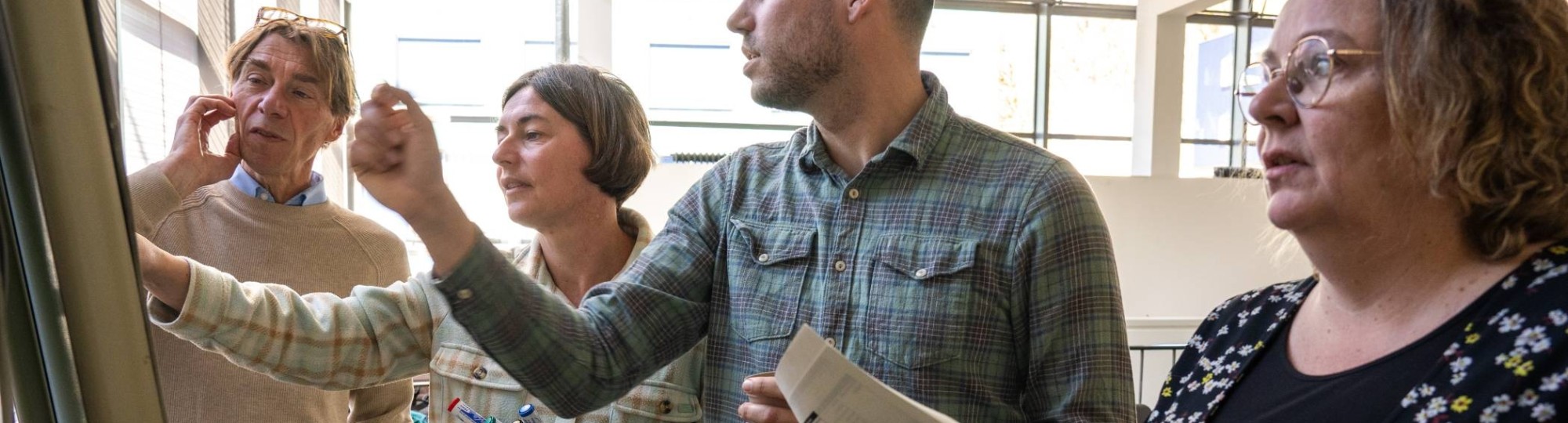 Foto's tijdens een teammeeting van OOI2