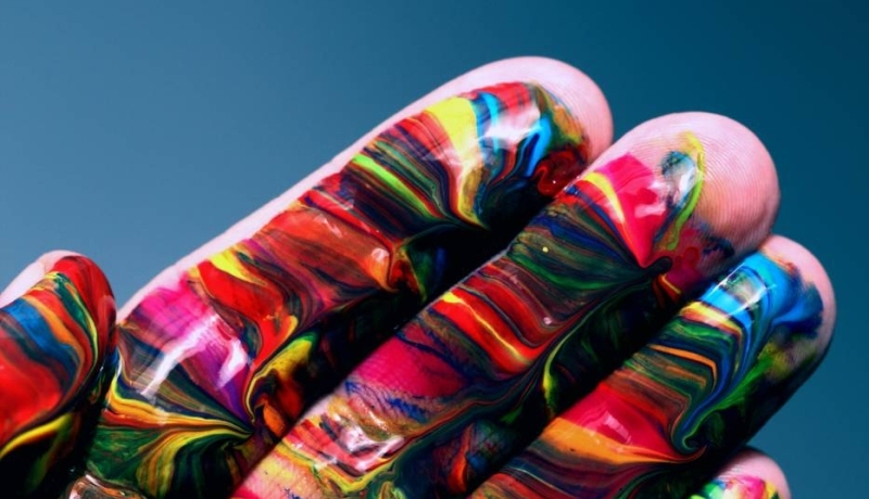 This picture is used to promote pride activities within the ISB community, multi coloured hand